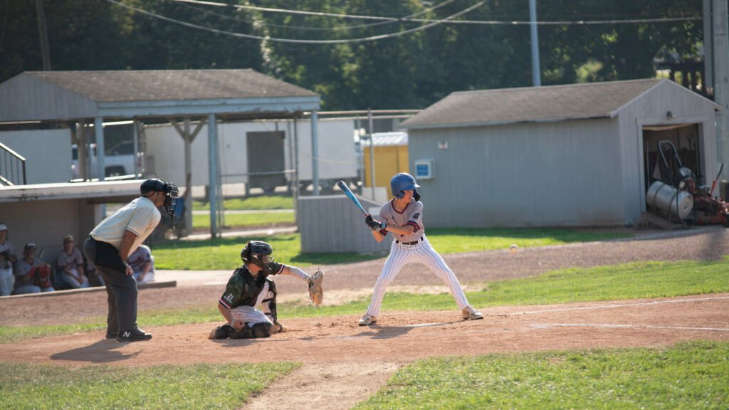 Zanesville's Jr Legion player Carter Hittle eyes a strike from the Cambridge pitcher.
