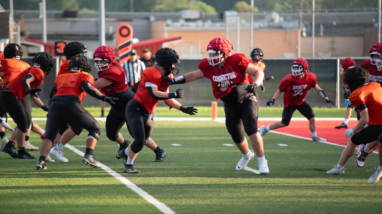 Coshocton Redskins football team defends against Dalton at a pre-season scrimmage.