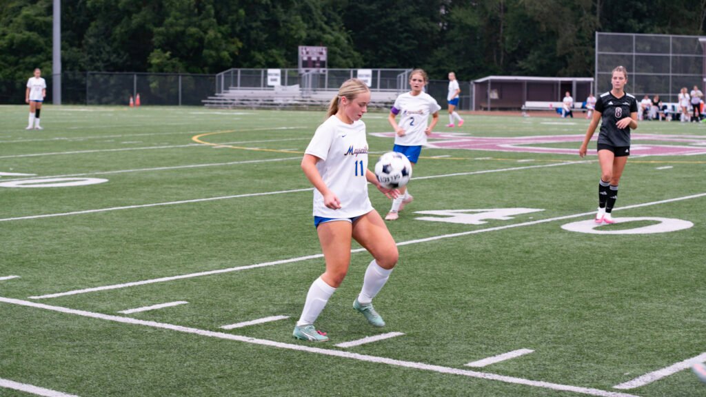 The Panther's Camryn Doane maneuvers the ball before passing downfield.