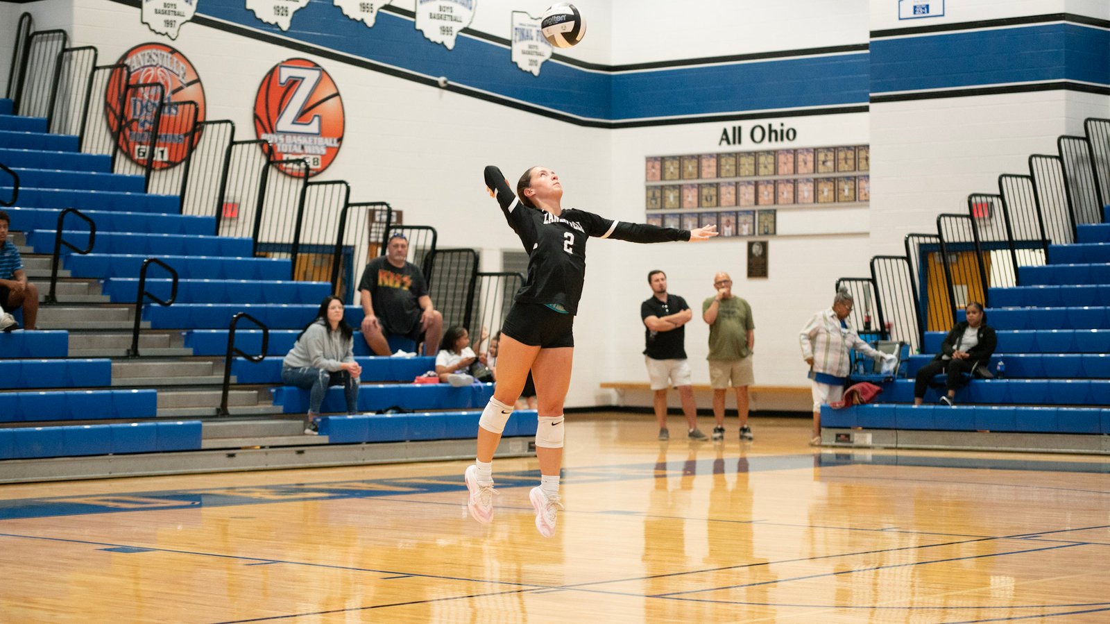 Zanesville's Cyaira Wallace serves the ball to Coshocton.