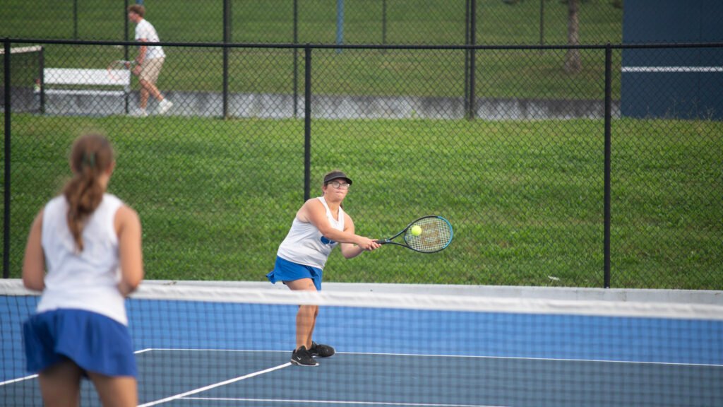 Cambrige's Allie Voorhies returns the ball to Zanesville.